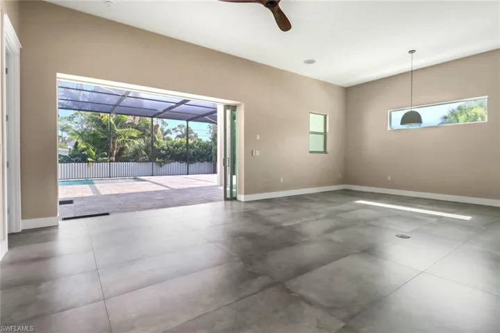 Empty room with baseboards and ceiling fan