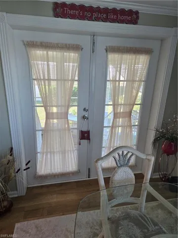 Entryway with dark hardwood / wood-style floors