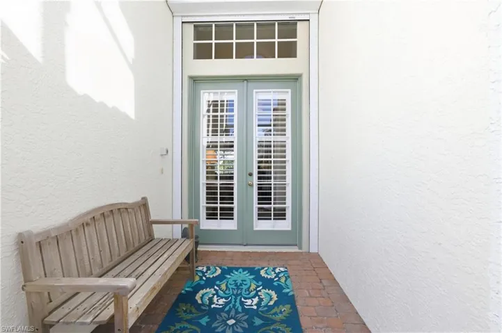View of exterior entry featuring french doors.