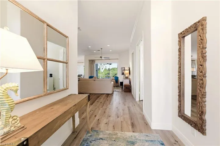 Hallway with Luxury Vinyl flooring and recessed lighting