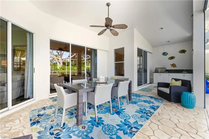 Outdoor Dining area under roof with outdoor kitchen