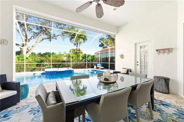 View of pool featuring outdoor dining area