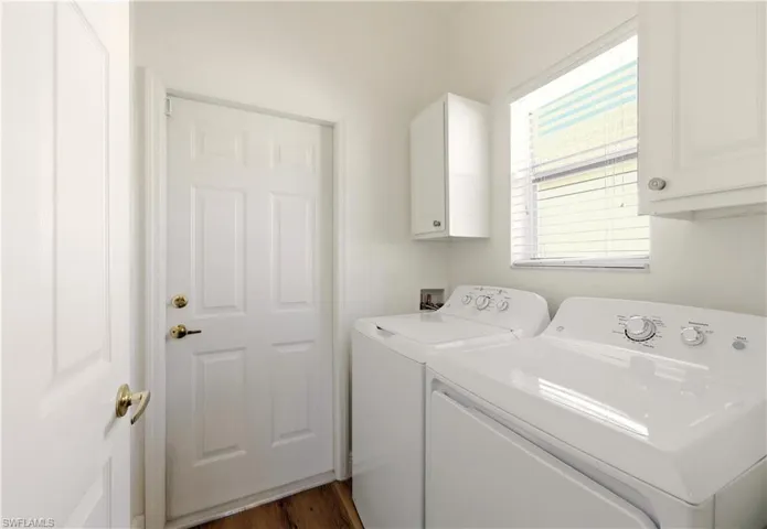 washing machine and clothes dryer, cabinet space, and Luxury Vinyl floors