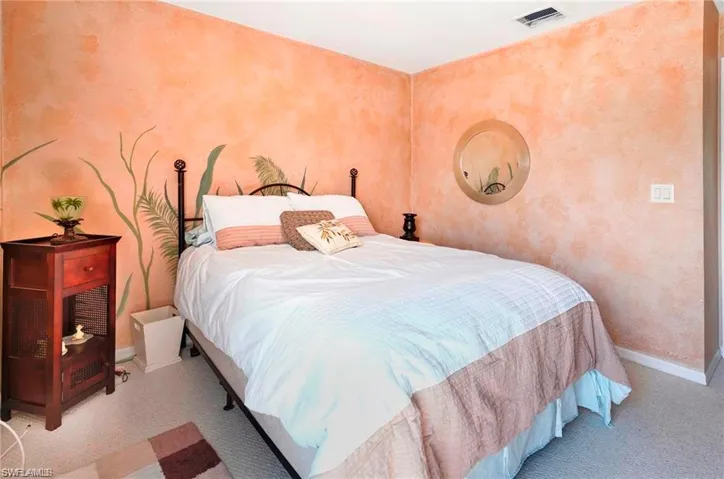 Bedroom featuring baseboards
