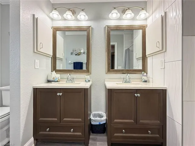 Primary Bathroom with Nice Fixtures and Dual Vanities