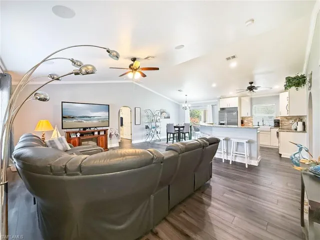 Great Room with Canister Lights, Crown Molding and Fresh Paint