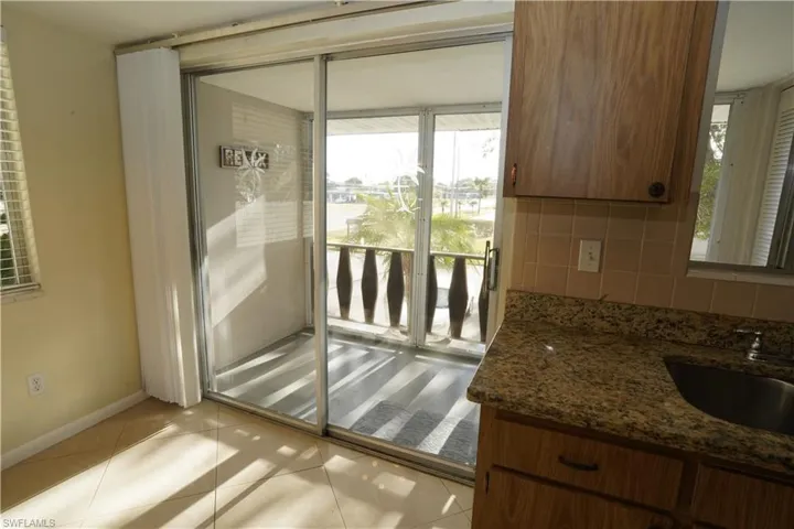 Entryway featuring healthy amount of natural light and tile patterned flooring