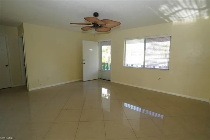 Unfurnished room featuring ceiling fan and light tile patterned floors