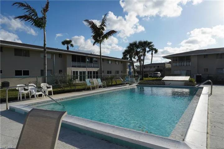 Community pool with a patio