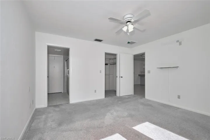 Another view of the owner's suite. Left door is the owner's bathroom complete with a tile shower, an older version of a California closet and entry back into the family room. I believe here is plenty of laminate flooring remaining to cover both this owner's bathroom floor and the second bath.