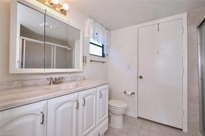 Nice Master's bathroom. What makes this room unique is that door actually leads to the two-car garage.  Back in the 80's that was considered an upgrade!