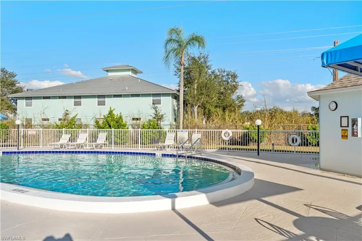 Community pool featuring a patio