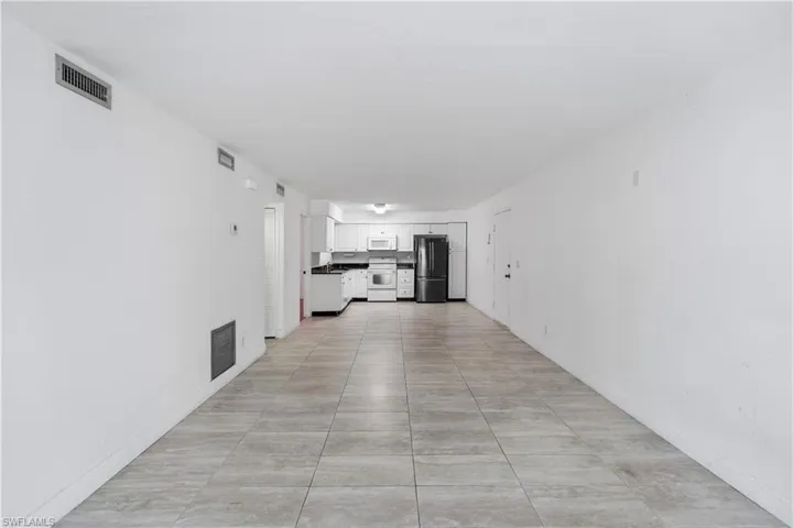 Hallway featuring baseboards