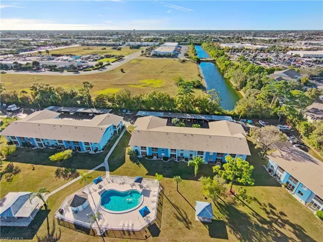 Drone / aerial view of a pool and a large body of water