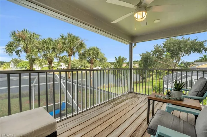 Wooden deck featuring ceiling fan