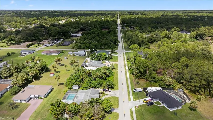 View of property location with nearby suburban area