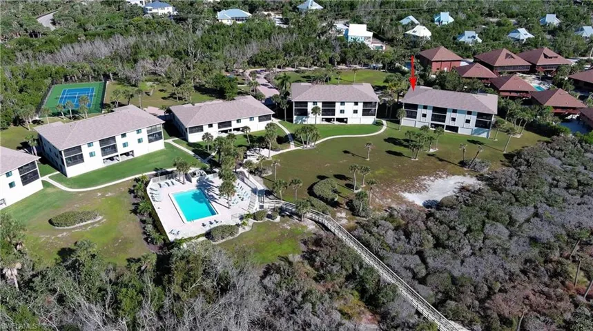Aerial view of property's location with a pool