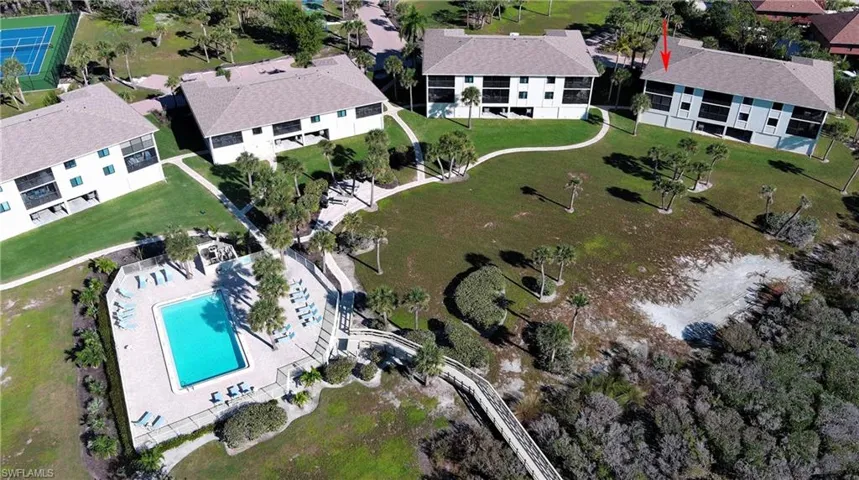 Aerial view of property's location with a pool area