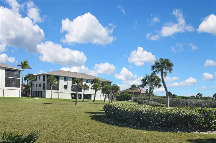 View of home's community featuring a yard