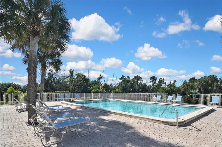 Community pool featuring a patio