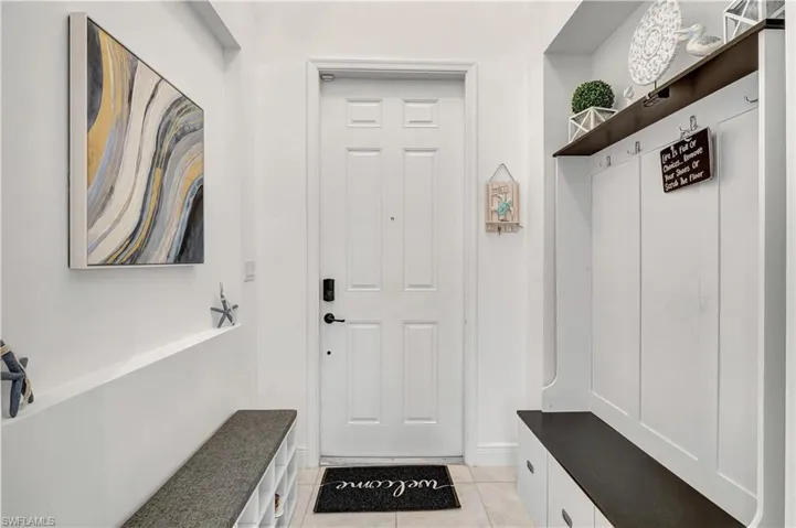 Mudroom featuring light tile patterned floors