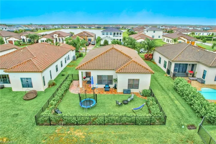 Back of property featuring a yard