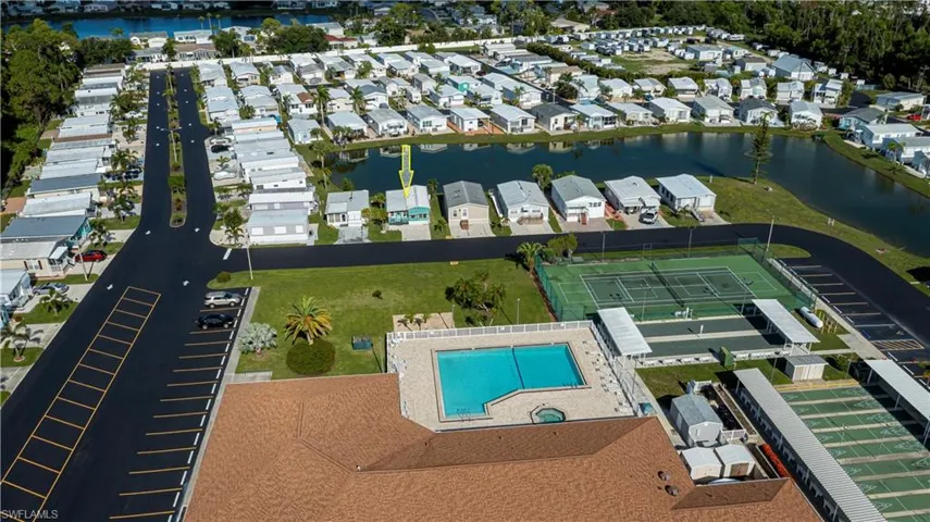 View of property location with a large body of water and nearby suburban area