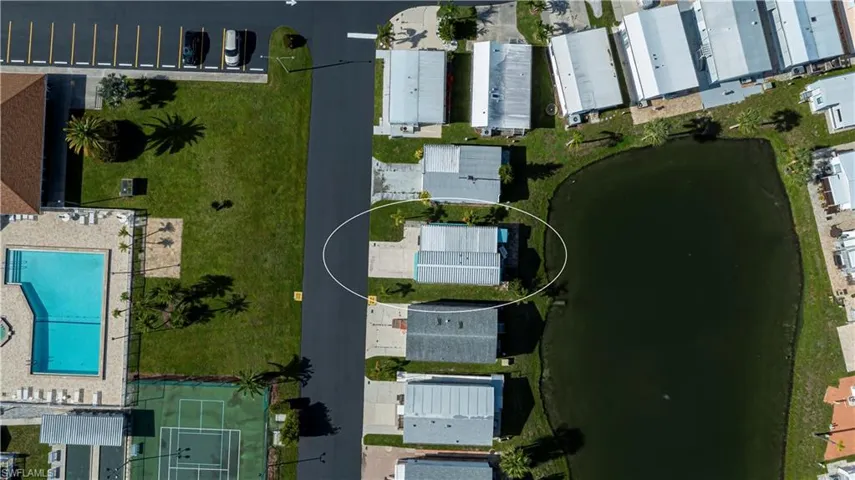Aerial overview of property's location with a pool area
