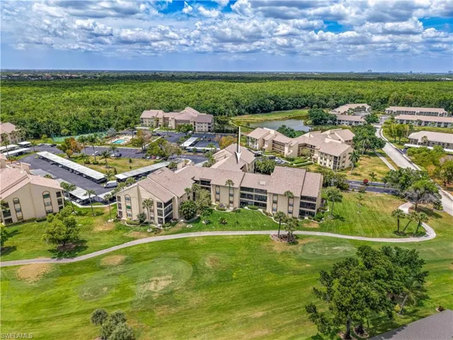 Bird's eye view with a forest view, a water view, and golf course view