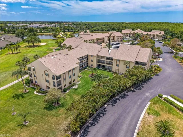 Bird's eye view featuring a water view and golf course view