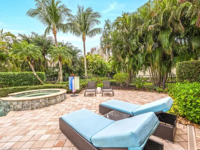 Private pool surrounded by beautiful landscaping