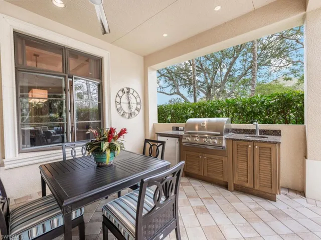 Fully equipped Outdoor kitchen complete with gas grill, sink and fridge