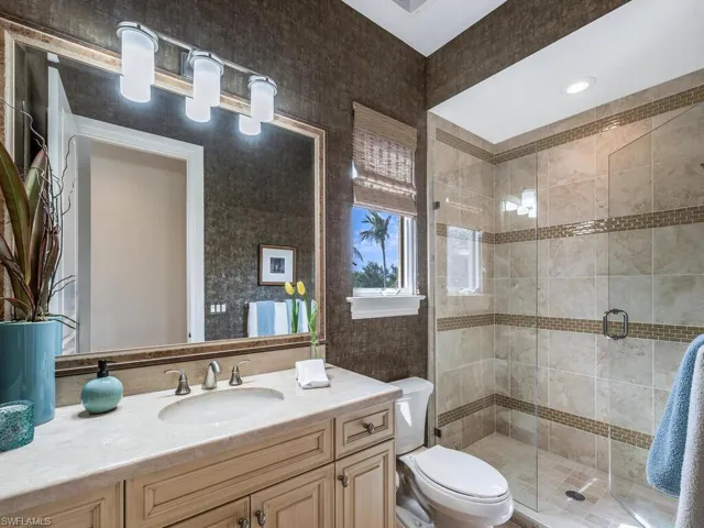 Bathroom 4 featuring glass shower stall