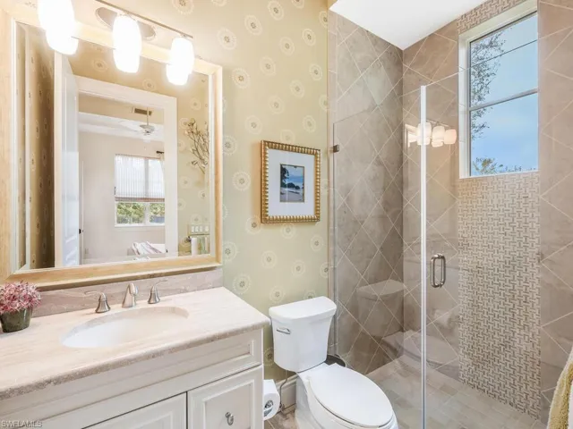 Bathroom 2 with vanity, a glass shower stall
