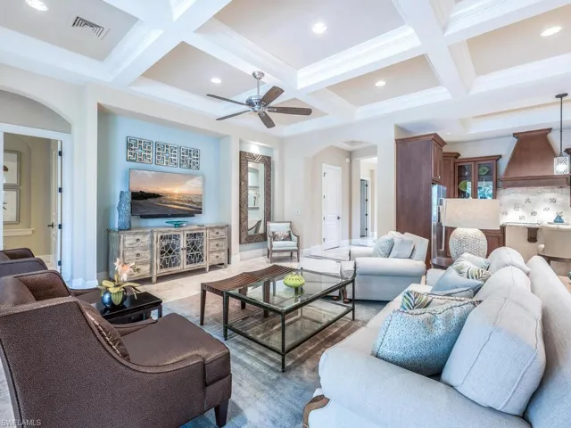 Living room featuring beam ceiling, and recessed lighting