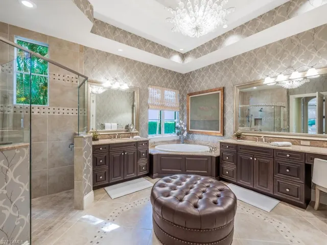 Primary Bathroom with dual sink and separate shower and garden tub