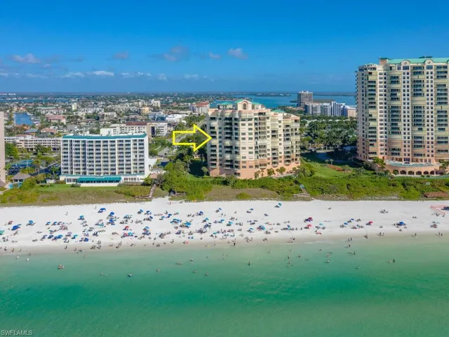 Drone / aerial view with a view of the beach and a water view