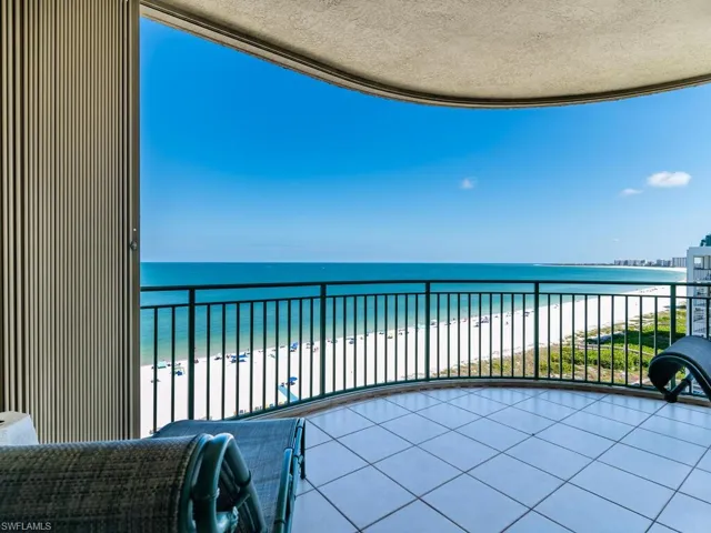 Balcony with a view of the beach and a water view