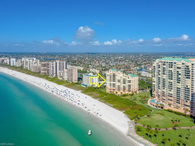 Drone / aerial view featuring a beach view and a water view