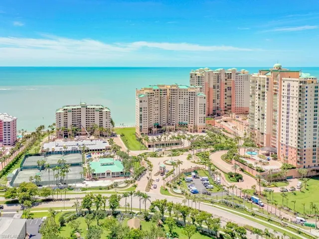Birds eye view of property with a water view