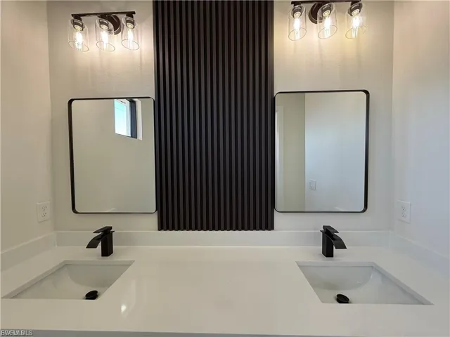 Bathroom featuring double vanity