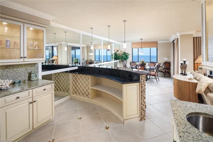 Entertain your best friends at the bar before enjoying the incredible views in the formal dining area