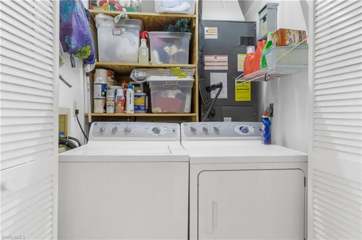 Laundry area with shelving.