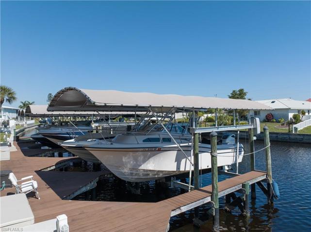 DEEDED boat dock with lift and canopy!  Boat sold separately - see confidential remarks or call listing agent.