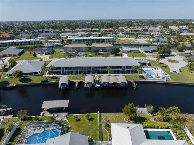 Rear of complex, private dock area and pool (right side)