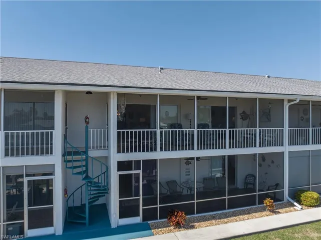 Unit 203 back stairway to dock area and walkway to pool.  Only steps away from YOUR deeded dock.