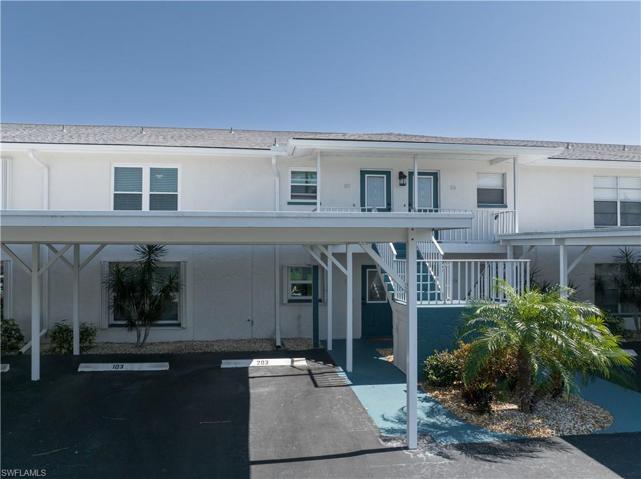 Front view of Unit 203 plus reserved parking at bottom of steps!