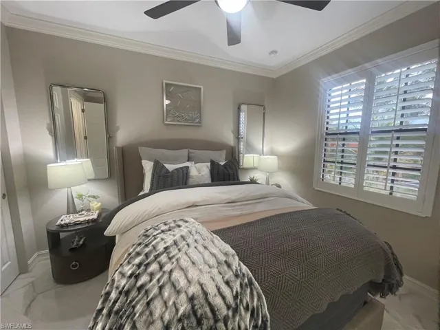 Bedroom featuring crown molding and ceiling fan