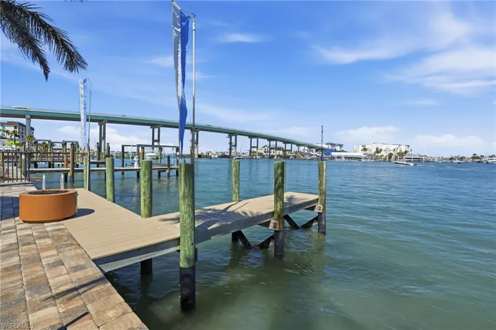 Dock area featuring a water view - Virtually Edited Image