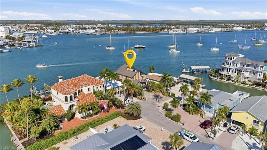 Aerial perspective of suburban area featuring a large body of water - Virtually Edited Image